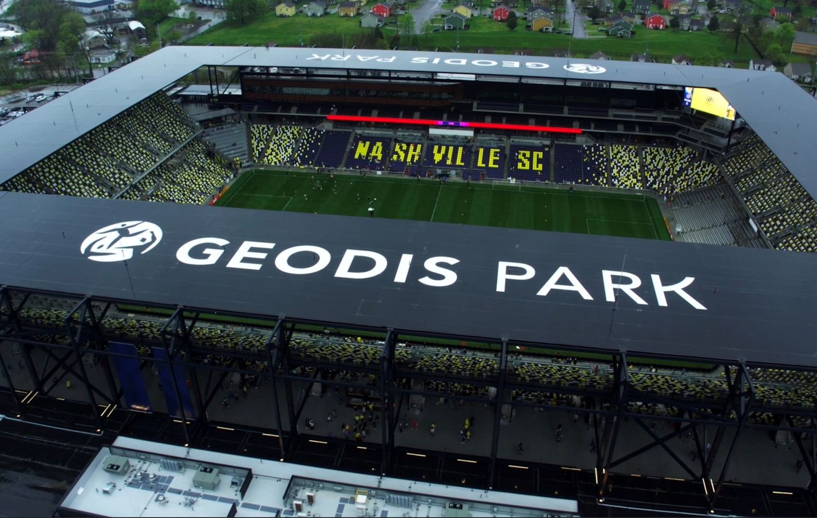 Aerial view of GEODIS Park stadium in Nashville with large exterior venue signage installed by AIS.
