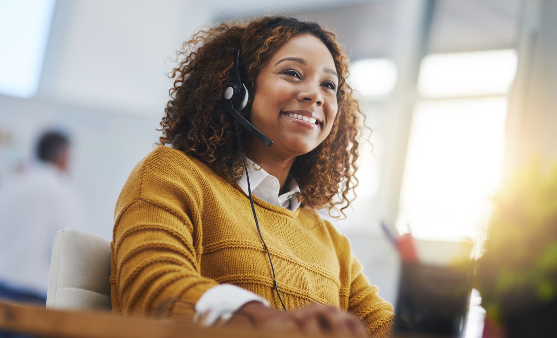 AIS account manager on a headset providing live customer support