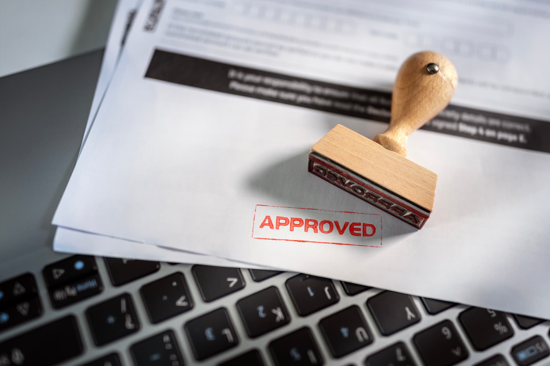Approved permit documentation with stamped paperwork ready for construction release