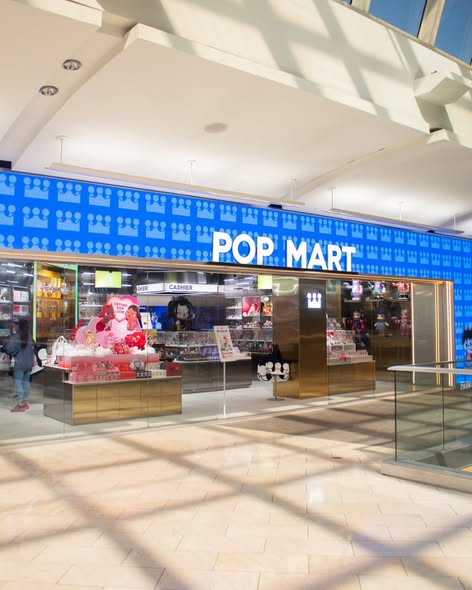 Pop Mart storefront signage and large-format character graphics at Florida Mall