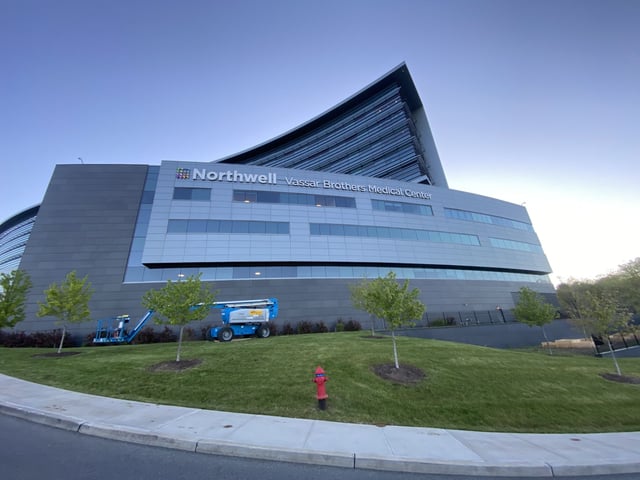 Northwell Vassar Brothers Medical Center exterior with large illuminated channel letters on a modern hospital facade