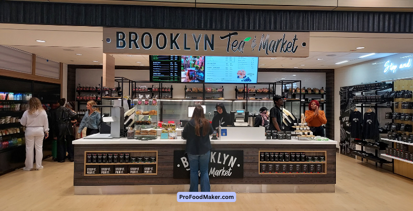 Brooklyn Tea & Market airport storefront with overhead dimensional lettering above the service counter