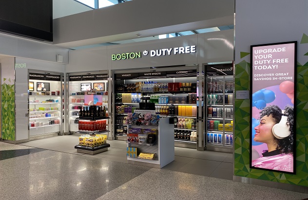Boston Duty Free terminal store with illuminated fascia lettering and digital advertising displays
