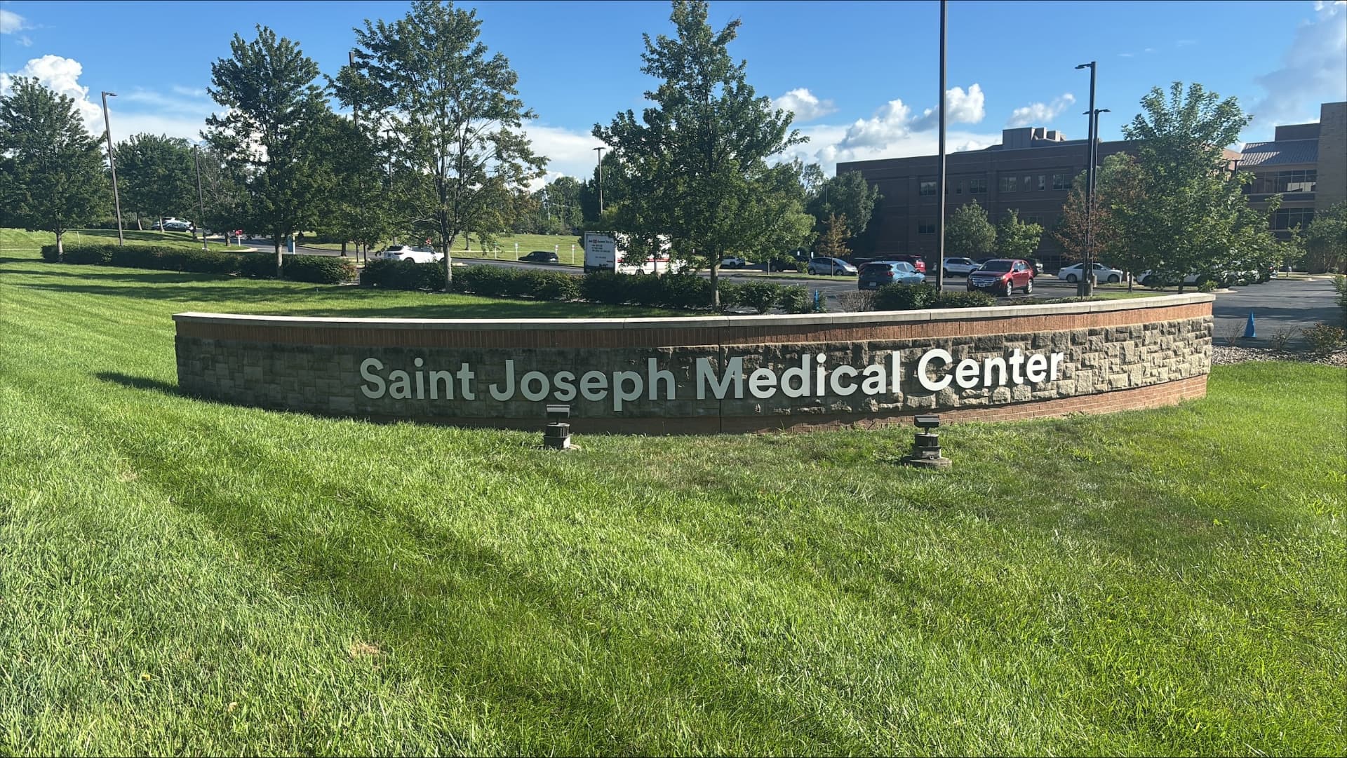Saint Joseph Medical Center dimensional letters mounted on a curved stone campus monument wall