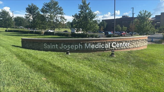 Saint Joseph Medical Center dimensional letters mounted on a curved stone campus monument wall